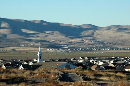 Aerial View of Saratoga Springs With Mountain Range in Background